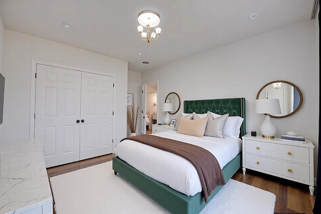 bedroom featuring dark hardwood / wood-style floors and a closet