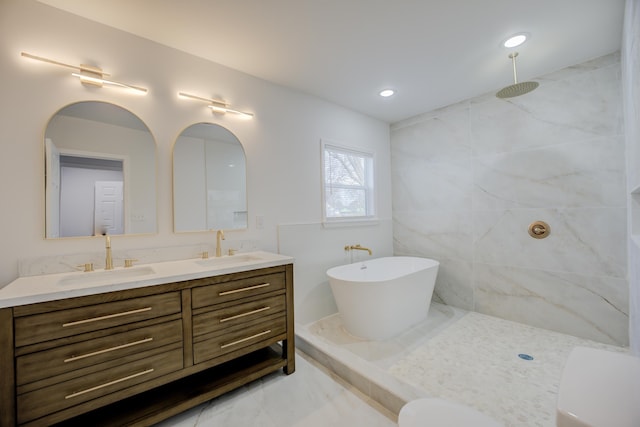 bathroom featuring vanity and shower with separate bathtub