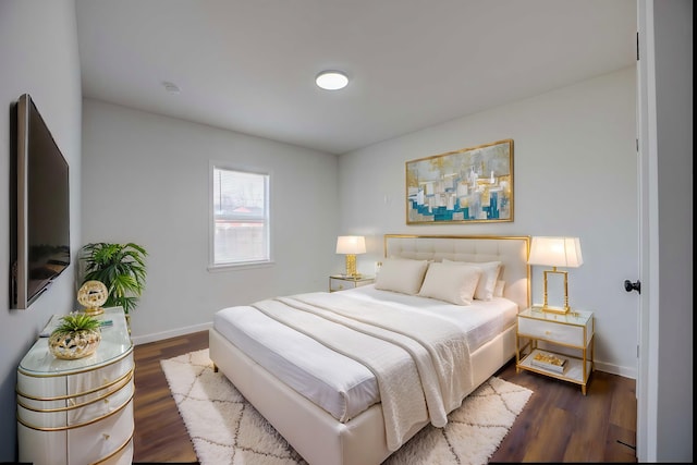 bedroom featuring dark hardwood / wood-style floors