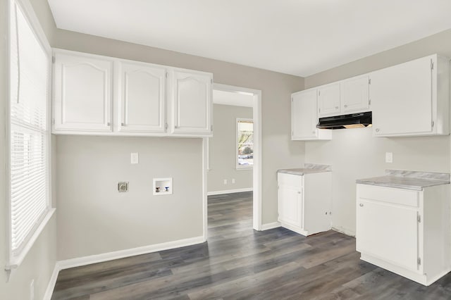 kitchen featuring dark hardwood / wood-style floors and white cabinets