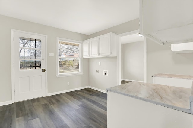 clothes washing area with dark wood-type flooring, cabinets, and hookup for a washing machine