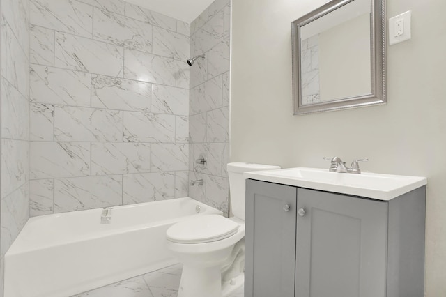 full bathroom featuring vanity, tiled shower / bath combo, and toilet