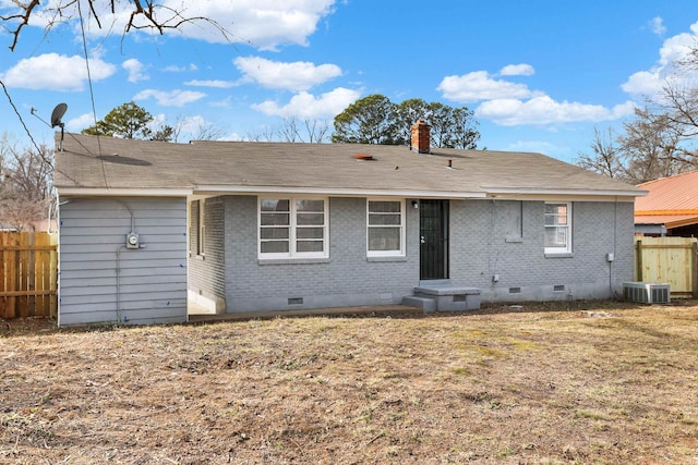 back of property featuring a yard and central AC unit