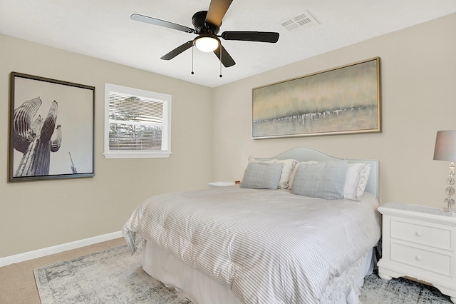 bedroom with light colored carpet and ceiling fan