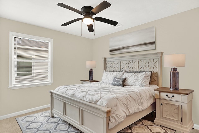 bedroom with light colored carpet and ceiling fan