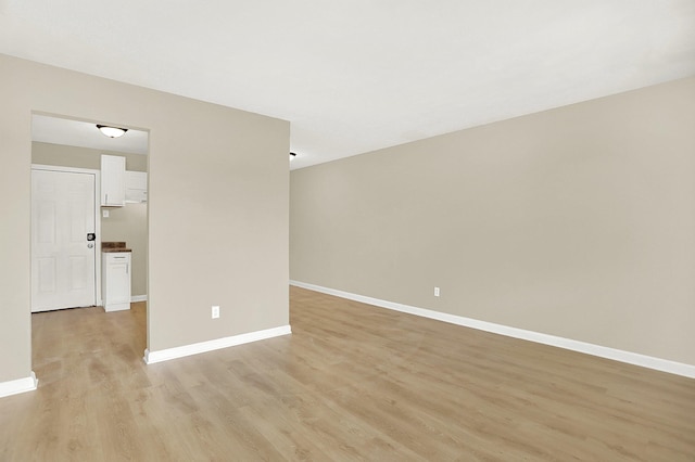 unfurnished room with light hardwood / wood-style flooring