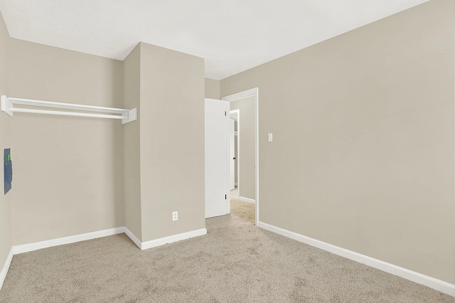 unfurnished bedroom featuring light colored carpet