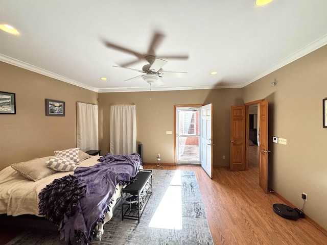 bedroom featuring hardwood / wood-style floors, access to outside, ornamental molding, and ceiling fan