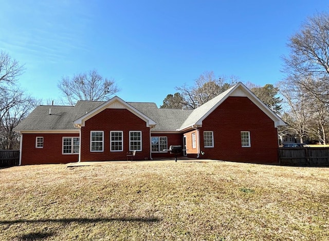 back of house with a yard