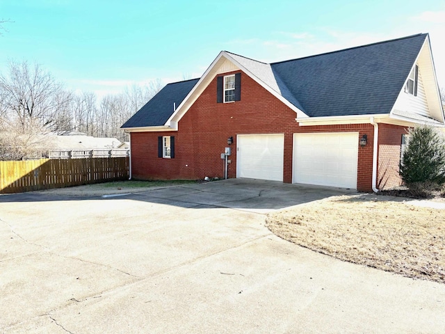 view of side of home with a garage