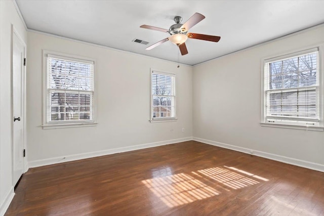 spare room with dark hardwood / wood-style flooring and ceiling fan