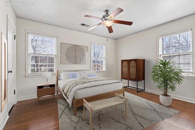 bedroom featuring ceiling fan and dark hardwood / wood-style floors