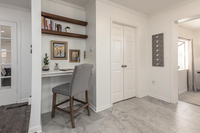 office with ornamental molding and built in desk