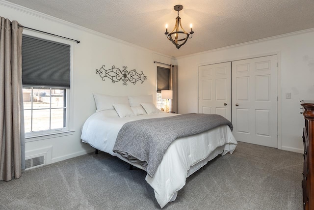 bedroom with ornamental molding, carpet, and a notable chandelier