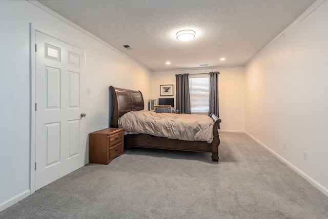 carpeted bedroom with crown molding and a textured ceiling