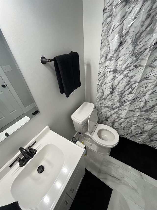 bathroom with vanity and toilet