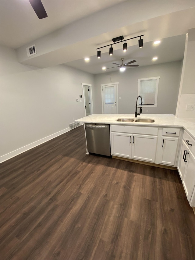 kitchen featuring sink, white cabinetry, stainless steel dishwasher, dark hardwood / wood-style floors, and ceiling fan