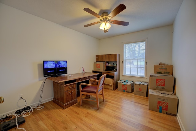 office area with ceiling fan and light hardwood / wood-style floors