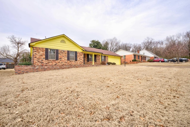 ranch-style house featuring a garage