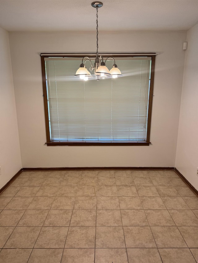584 Shofner Ave, Memphis, TN 38109 - unfurnished room with a chandelier and baseboards