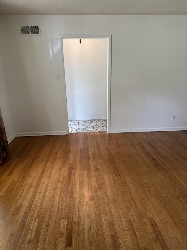 584 Shofner Ave, Memphis, TN 38109 - empty room with wood finished floors and baseboards