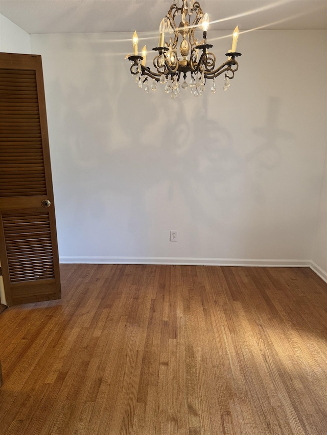 584 Shofner Ave, Memphis, TN 38109 - empty room with a chandelier and wood finished floors