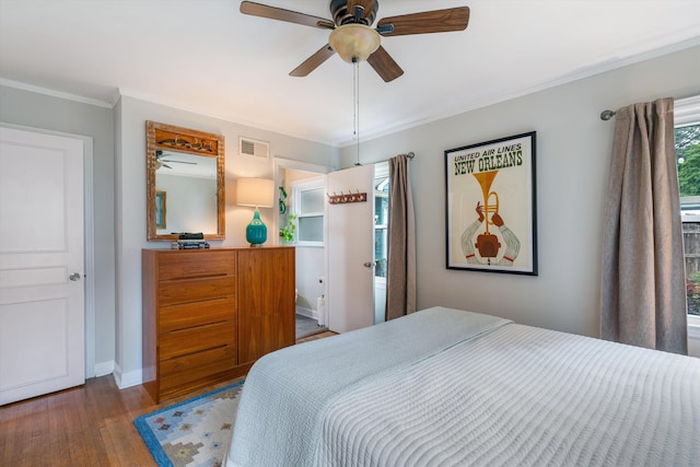 bedroom featuring crown molding, ceiling fan, and hardwood / wood-style floors