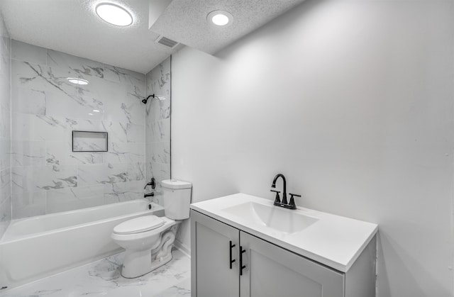 full bathroom with vanity, toilet, tiled shower / bath combo, and a textured ceiling