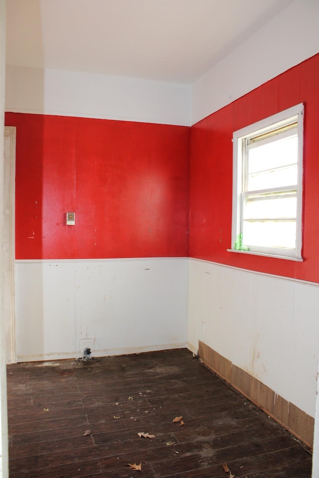 empty room featuring dark wood-type flooring