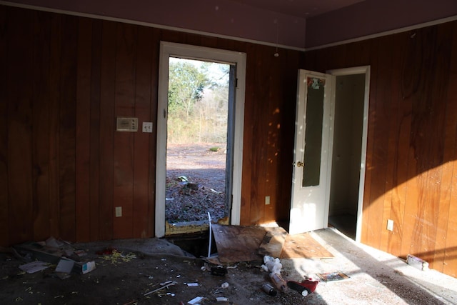 entryway featuring wooden walls