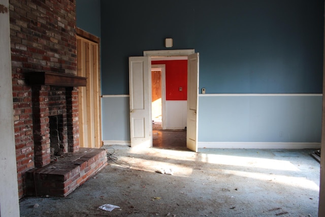 unfurnished living room featuring a fireplace