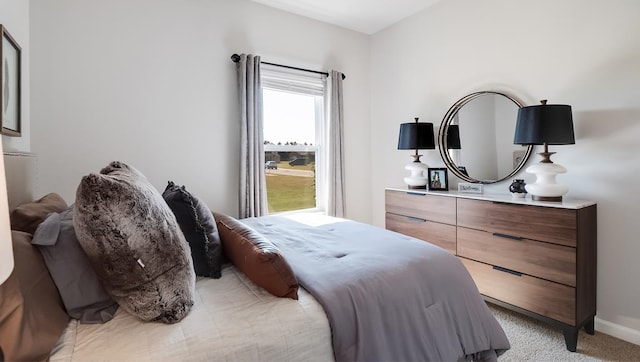 bedroom featuring light carpet