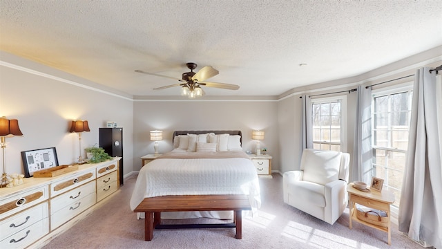 bedroom with light carpet, ceiling fan, ornamental molding, and a textured ceiling