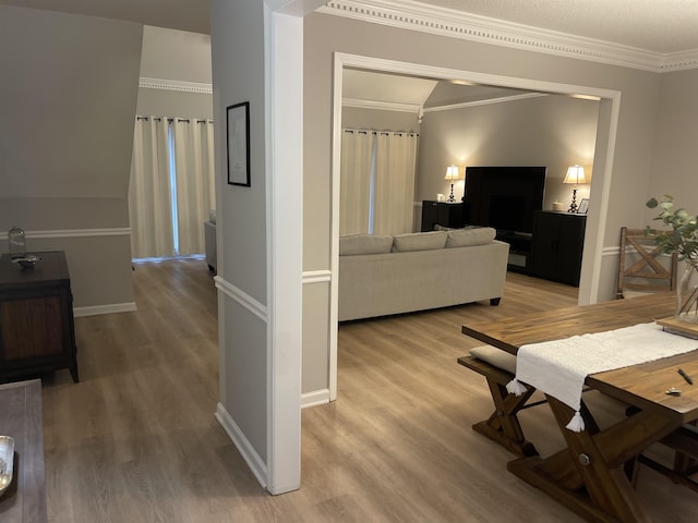 living room featuring ornamental molding and hardwood / wood-style floors