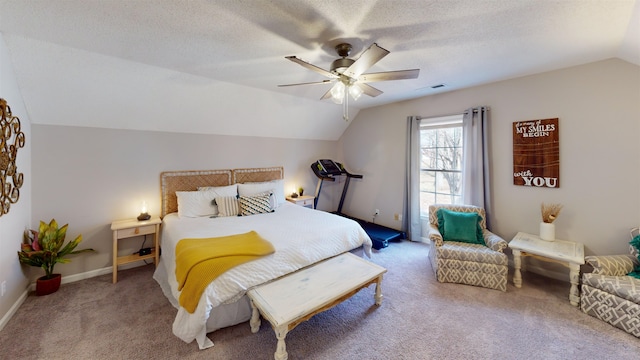 bedroom with vaulted ceiling, carpet floors, ceiling fan, and a textured ceiling