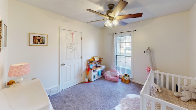 carpeted bedroom featuring ceiling fan