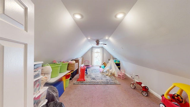 playroom with vaulted ceiling and carpet flooring