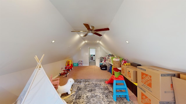 rec room featuring lofted ceiling, carpet flooring, and ceiling fan