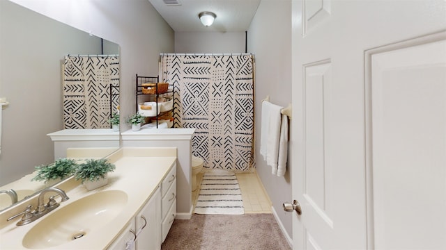 bathroom featuring vanity and a shower with shower curtain