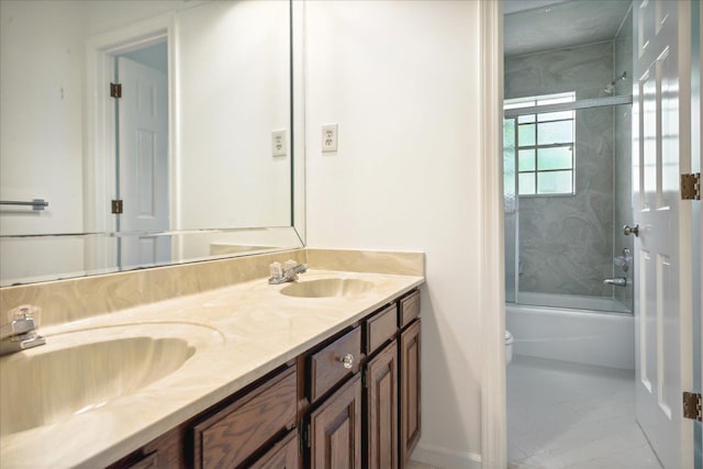 full bathroom featuring shower / bath combination with glass door, vanity, and toilet