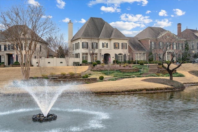 view of front of property featuring a water view