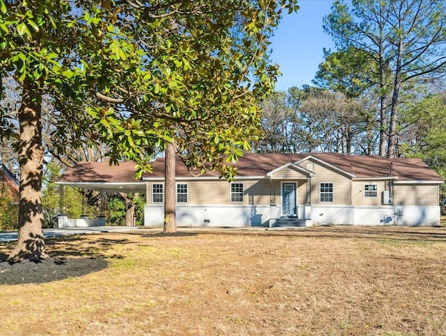 ranch-style home featuring a front yard and a carport