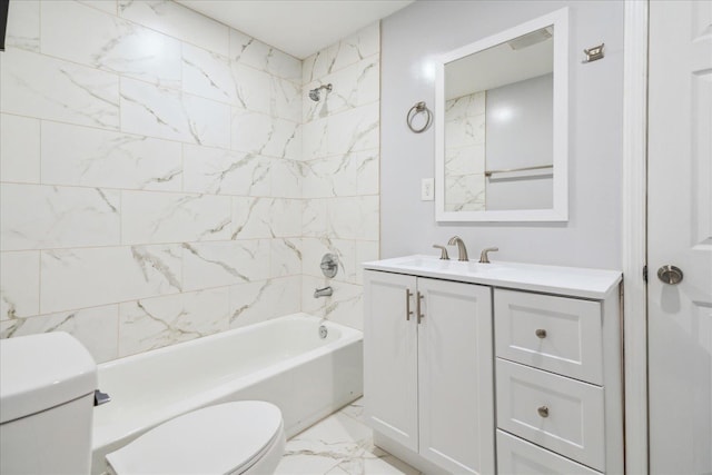 full bathroom with vanity, tiled shower / bath combo, and toilet