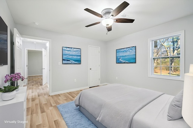 bedroom featuring ceiling fan and light hardwood / wood-style floors