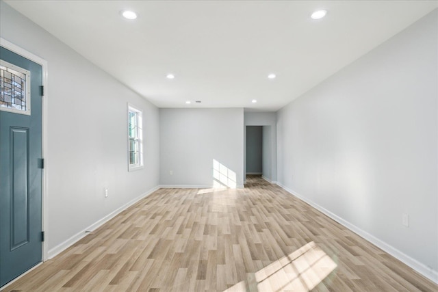 unfurnished living room with light hardwood / wood-style floors