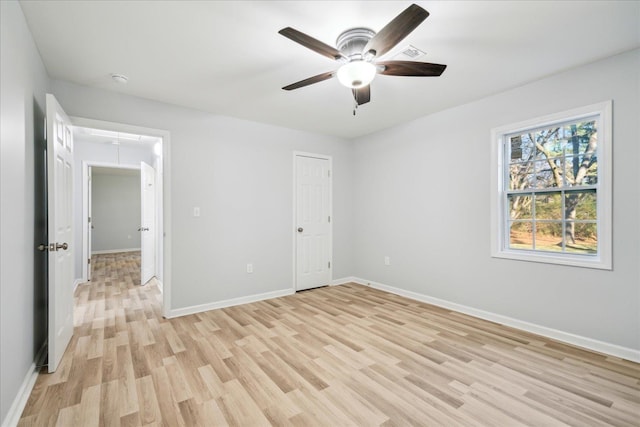 unfurnished bedroom with light hardwood / wood-style flooring and ceiling fan