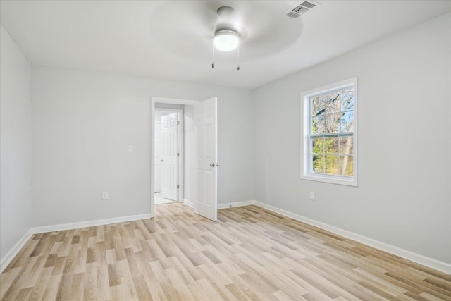 unfurnished room with light hardwood / wood-style flooring