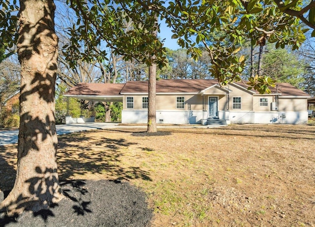 ranch-style home with a carport