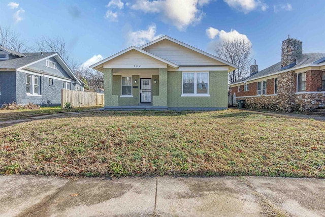 bungalow-style home featuring a front yard and a porch