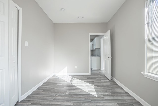 unfurnished bedroom featuring hardwood / wood-style flooring